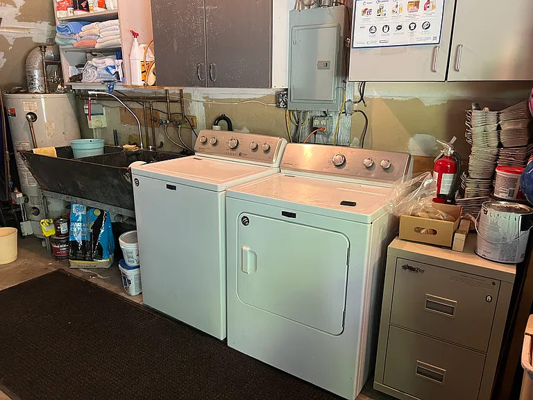 washer and dryer located in garage below for tenant use.
