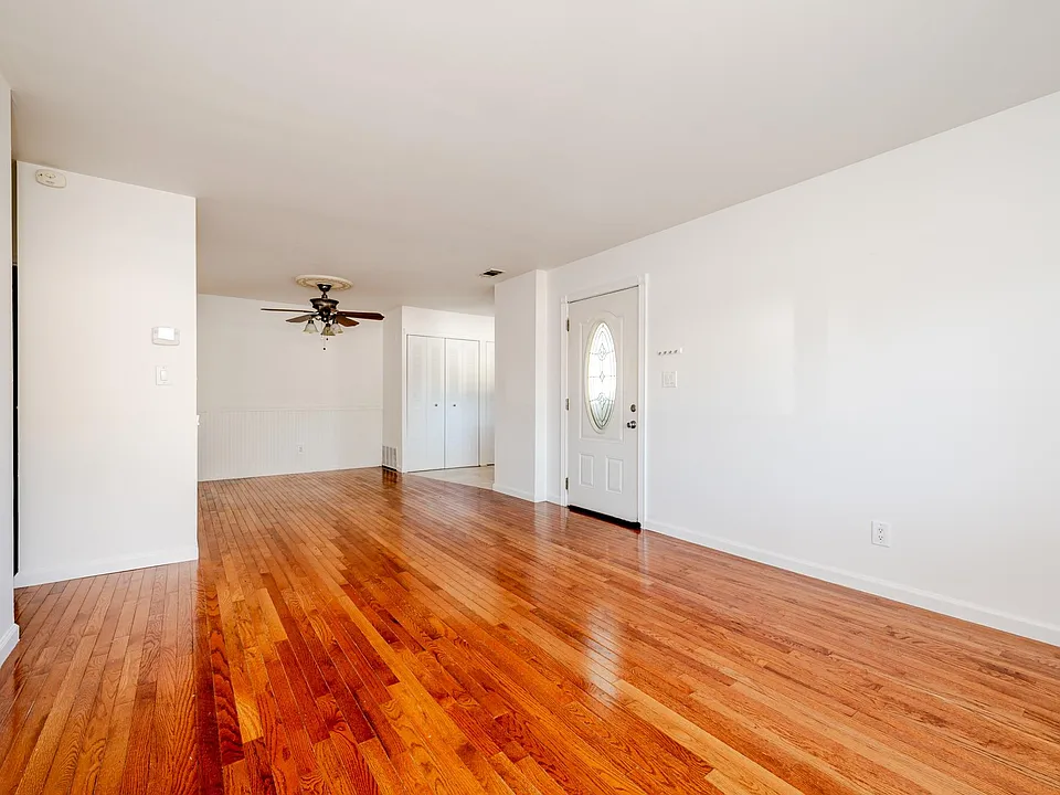 Living room, with beautiful hardwood floors.