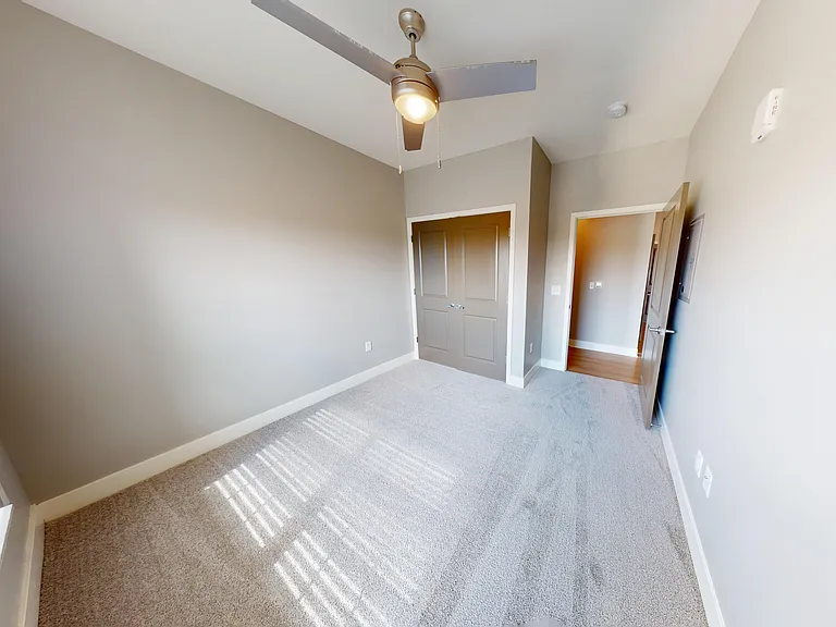 The second bedroom includes a large double-door closet. The second bedroom includes a large double-door closet.