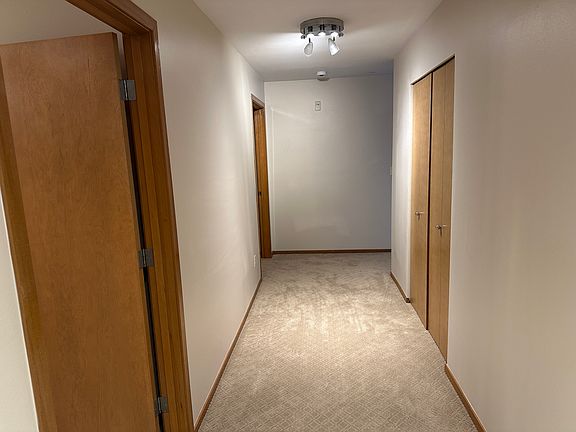 condo's main entrance. brand new carpet. one full bath on the left
