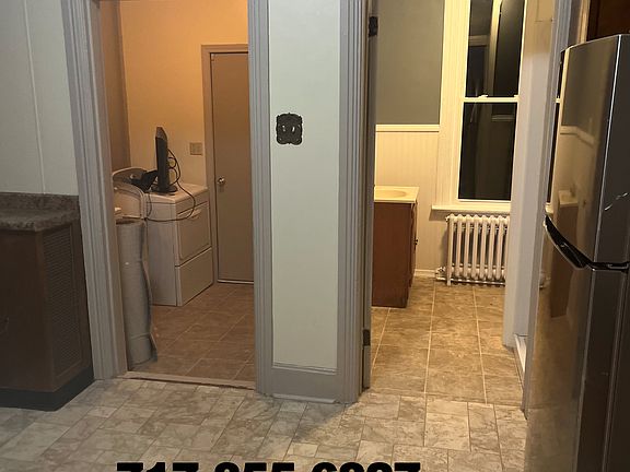 Laundry room and bath view from kitchen