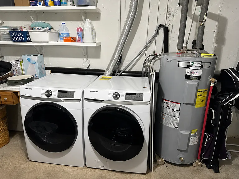 Full-size washer and dryer on the lower level, included with the unit