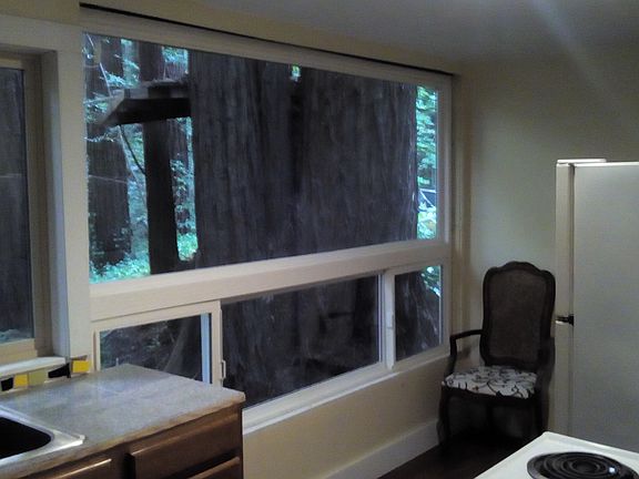 Kitchen with Granite Tile and Mosaic Backsplash