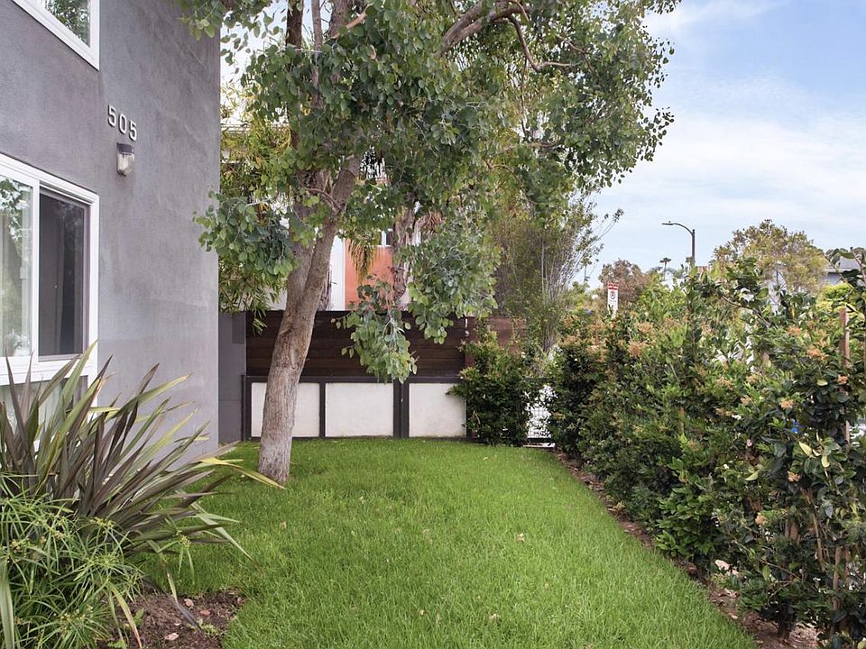 Front yard: Privacy and greenery maintained by weekly gardening service.