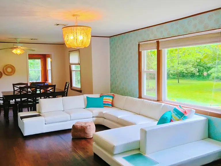 Huge Picture Window Allows For Sun-Drenched Living Room With Original Wood Floors!
