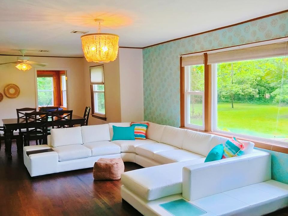 Huge Picture Window Allows For Sun-Drenched Living Room With Original Wood Floors!