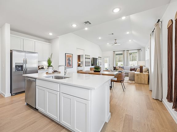 Kitchen in the Magnolia home plan by Trophy Signature Homes - REPRESENTATIVE PHOTO