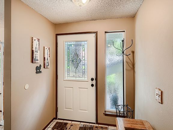 The foyer has room to sit down to take off shoes.