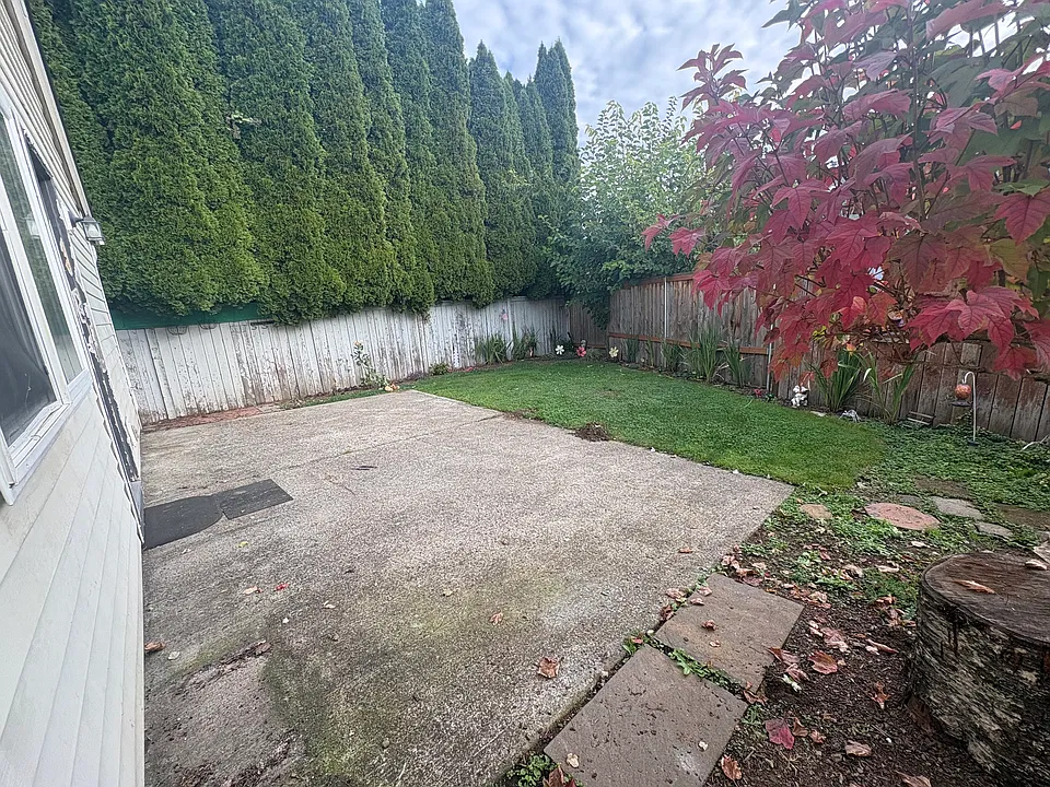 Fenced, private backyard with spacious patio.