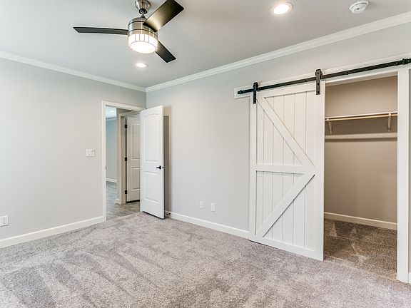 Master bedroom with custom barn door