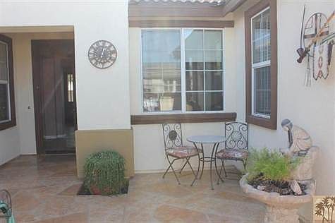 Entry to the Courtyard has Restora floor with sitting area.