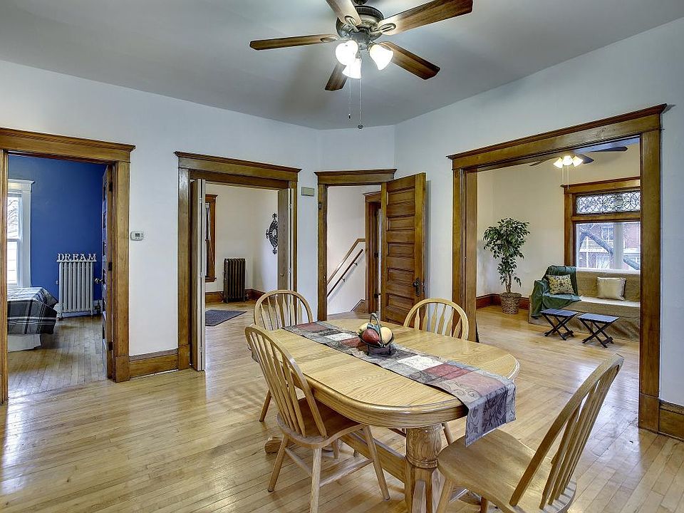 Spacious formal dining room with natural woodwork throughout