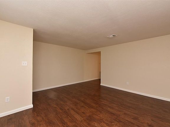 View of formal room looking towards hallway to remainder of house.