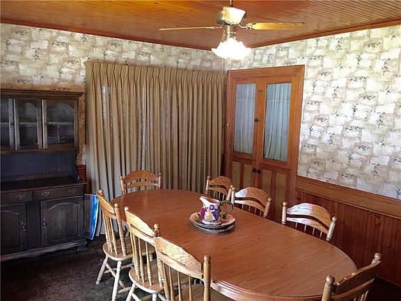 Large dining room with sliding door leading to the sunroom.