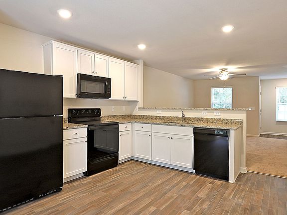 All energy-efficient appliances, granite countertops and gorgeous wood-look flooring are included