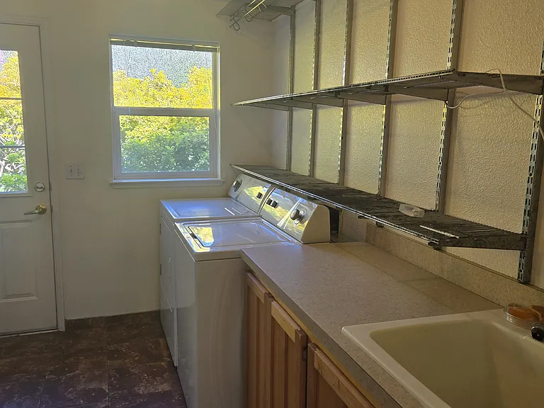 Laundry Room with door to backyard