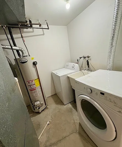 washer and dryer included laundry tub in between