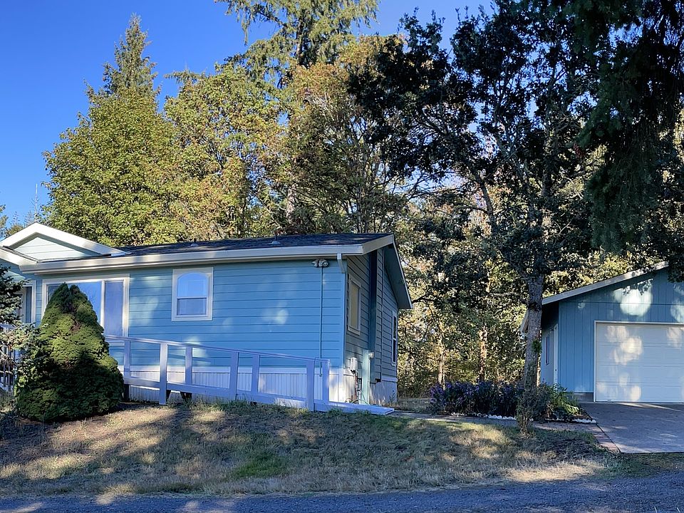 View of the home's front and the detached two car garage