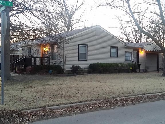 House sits on corner lot w/ fenced back yard