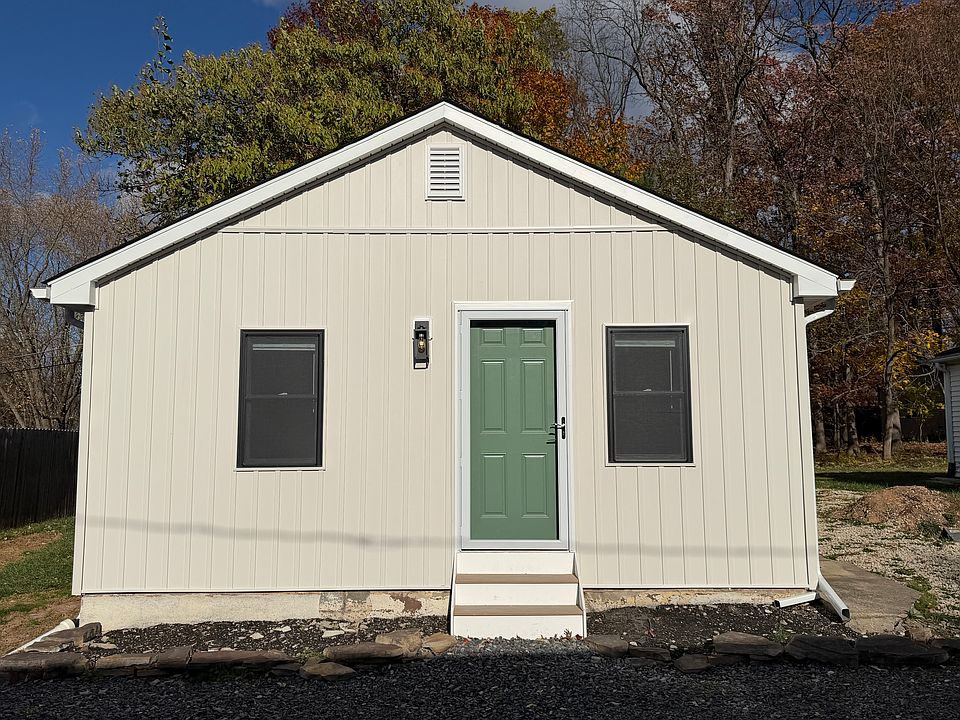 exterior front - board and batten siding, new energy-efficient windows, storm door