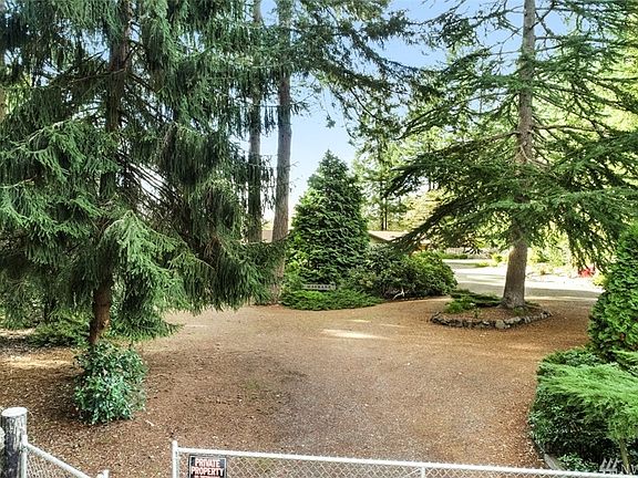 Entry to fully fenced property includes an electric gate (automated) plus remote controls. Secluded and secured.