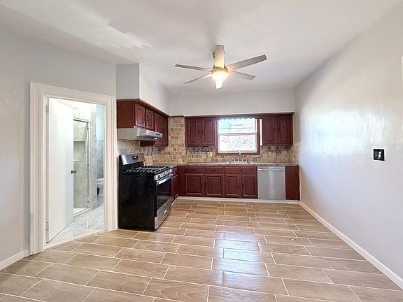 kitchen with bathroom door on the left