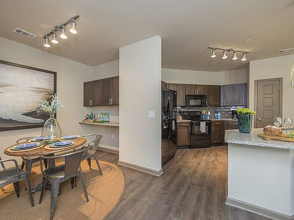 Spacious Dining Room with Work Area and View into Large Open Kitchen | Apartments in Nashville | 909 Flats