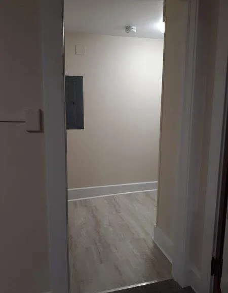 Plenty of room for a small table or shelves for Laundry and is tiled as well.