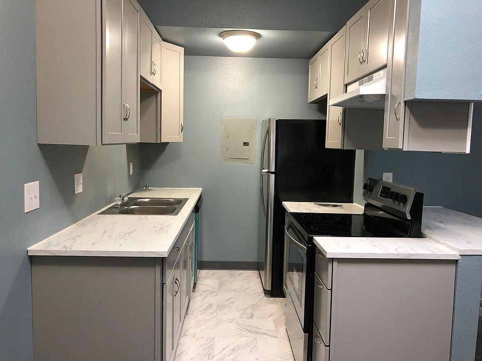 Brand new stainless steel appliances with open seating bar-perfect for meals or a desk.