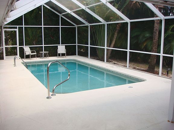 Heated pool with large deck & screen cage