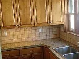 Custom Kit, with Alder wood cabinets, granite, travertine tile