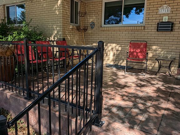 Stone porch, rod iron rail Beautiful