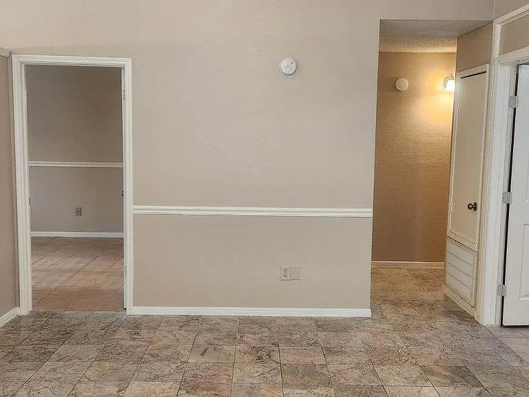 Living room leads to Master bedroom , through hall way with 2nd bedroom, and 3rd bedroom on the right of living room . Master bedroom has walk-in closet