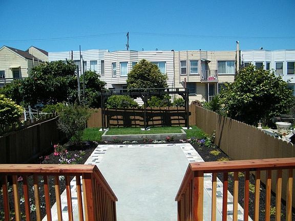 Spacious Deck to your Large Landscaped Yard with Pergoal