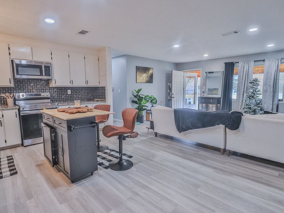 Kitchen and living area. *Furniture not included.