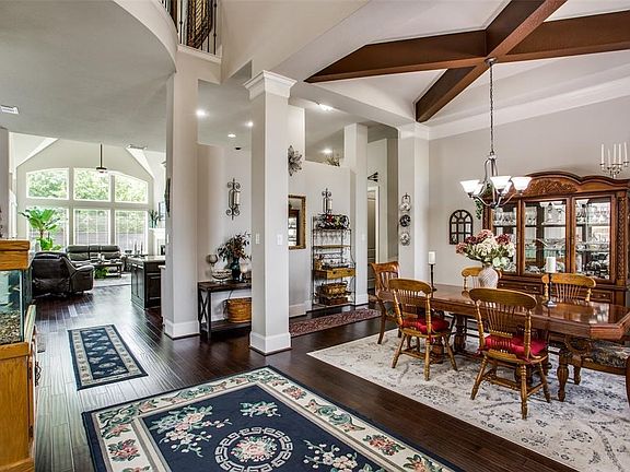 Entry into home showcases design features and crown molding.