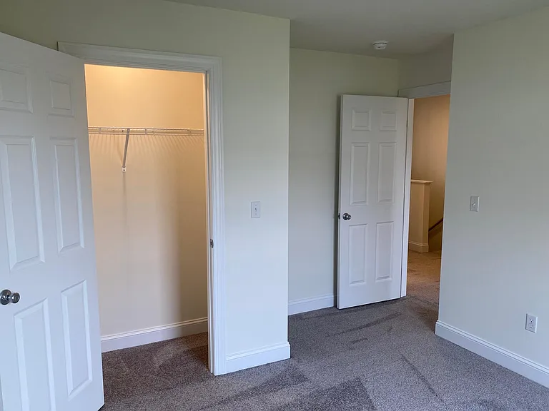 Bedroom #3 with closet and exit to hallway