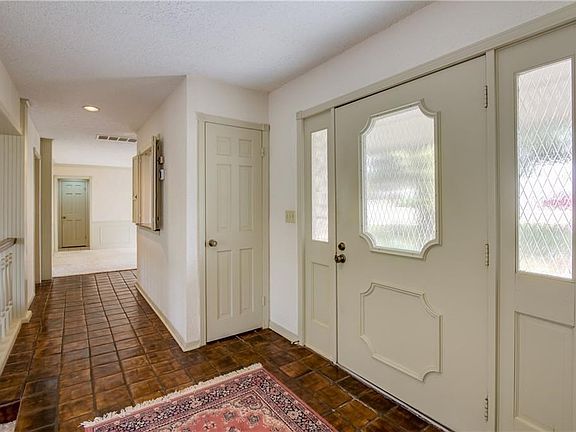 A bright & welcoming entry, with tile walkways.