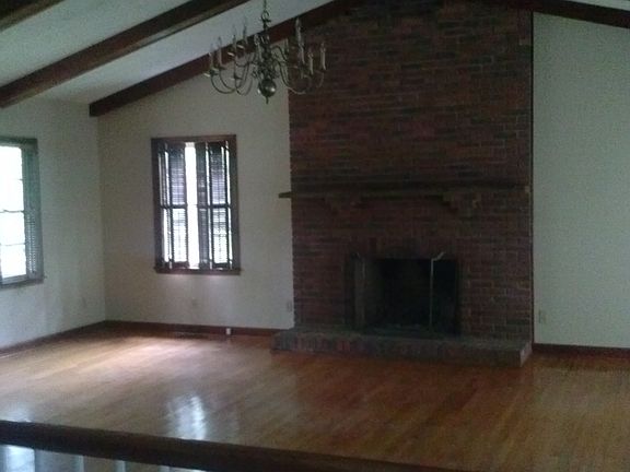 Large den with fire place