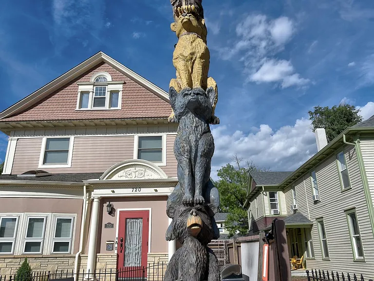 Front of building. Original hand craved totem pole.