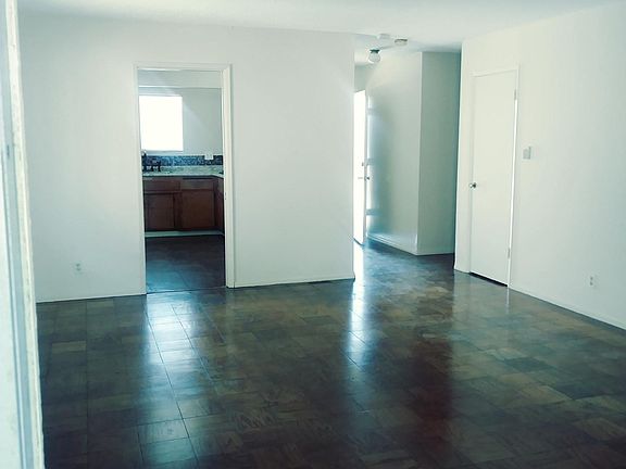 Living Room facing front door and kitchen.