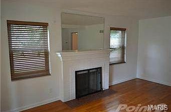 Expansive living room with hardwood flooring and fully-functioni