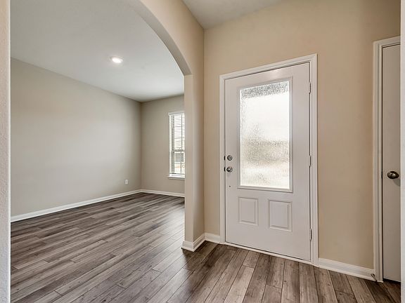 The entryway is highlighted by this gorgeous 3 4 lite door