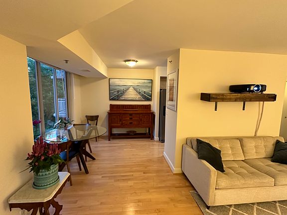 View of living room, dining room and dining room sideboard