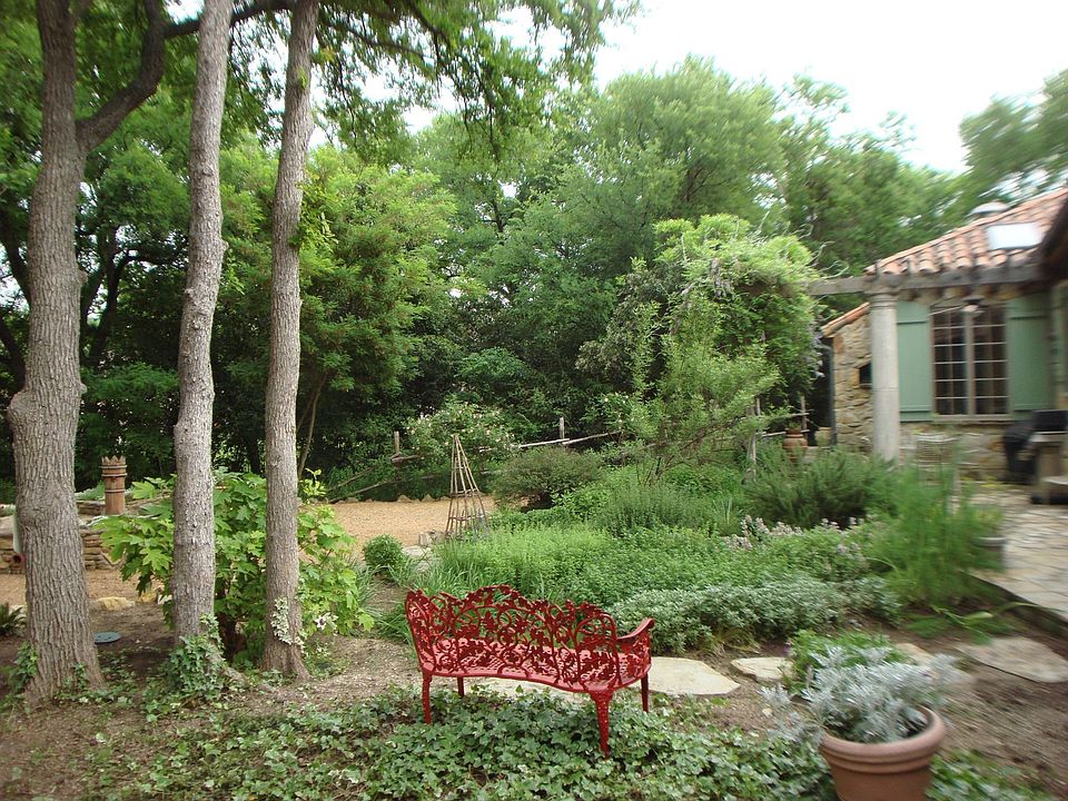 Creek lot with Boyd and Heiderich European designed landscape.