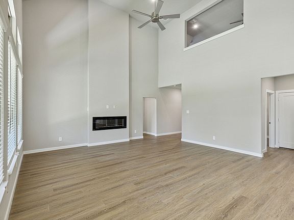 Living Room in the Hendrix home plan by Trophy Signature Homes - REPRESENTATIVE PHOTO