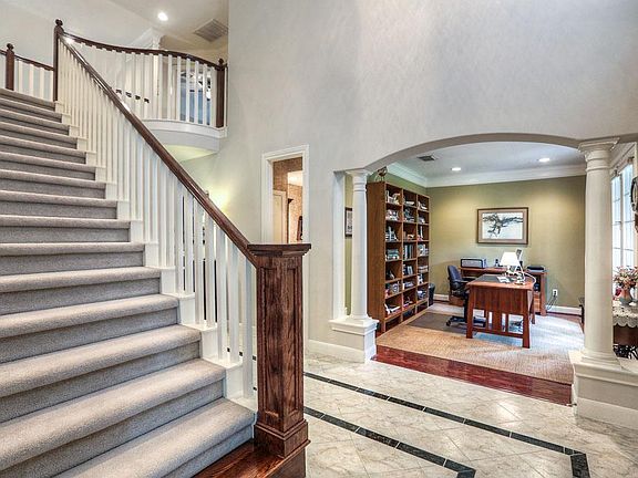 Stunning foyer and wide staircase.