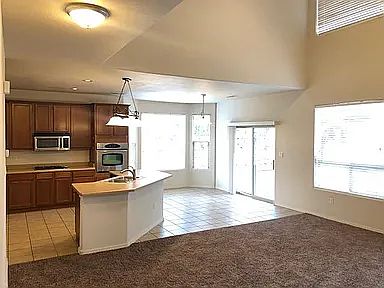 View of kitchen and breakfast nook from living room
