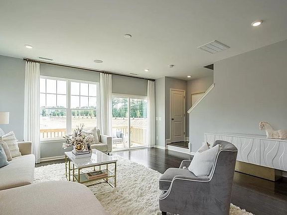 Family room of the model home with same floor plan.