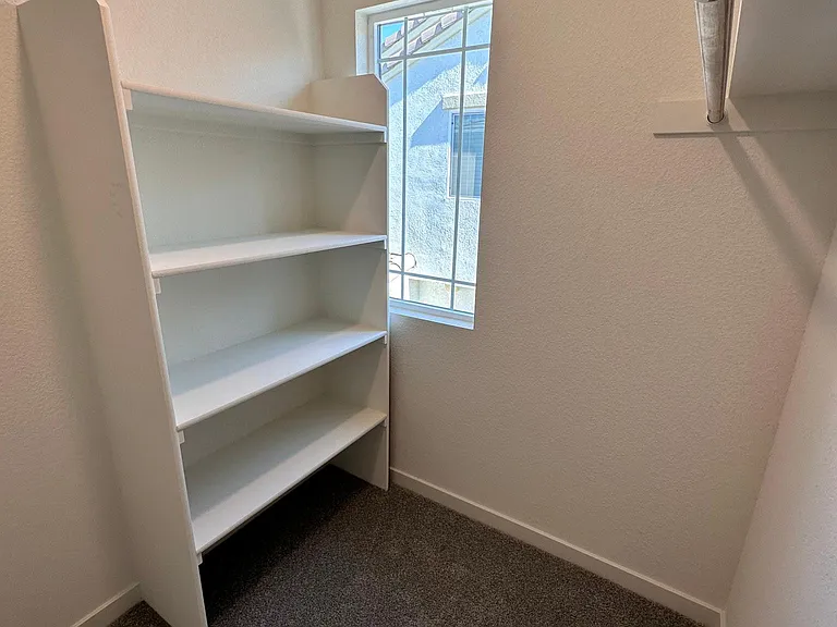 Master Bedroom Walk-in closet with dresser